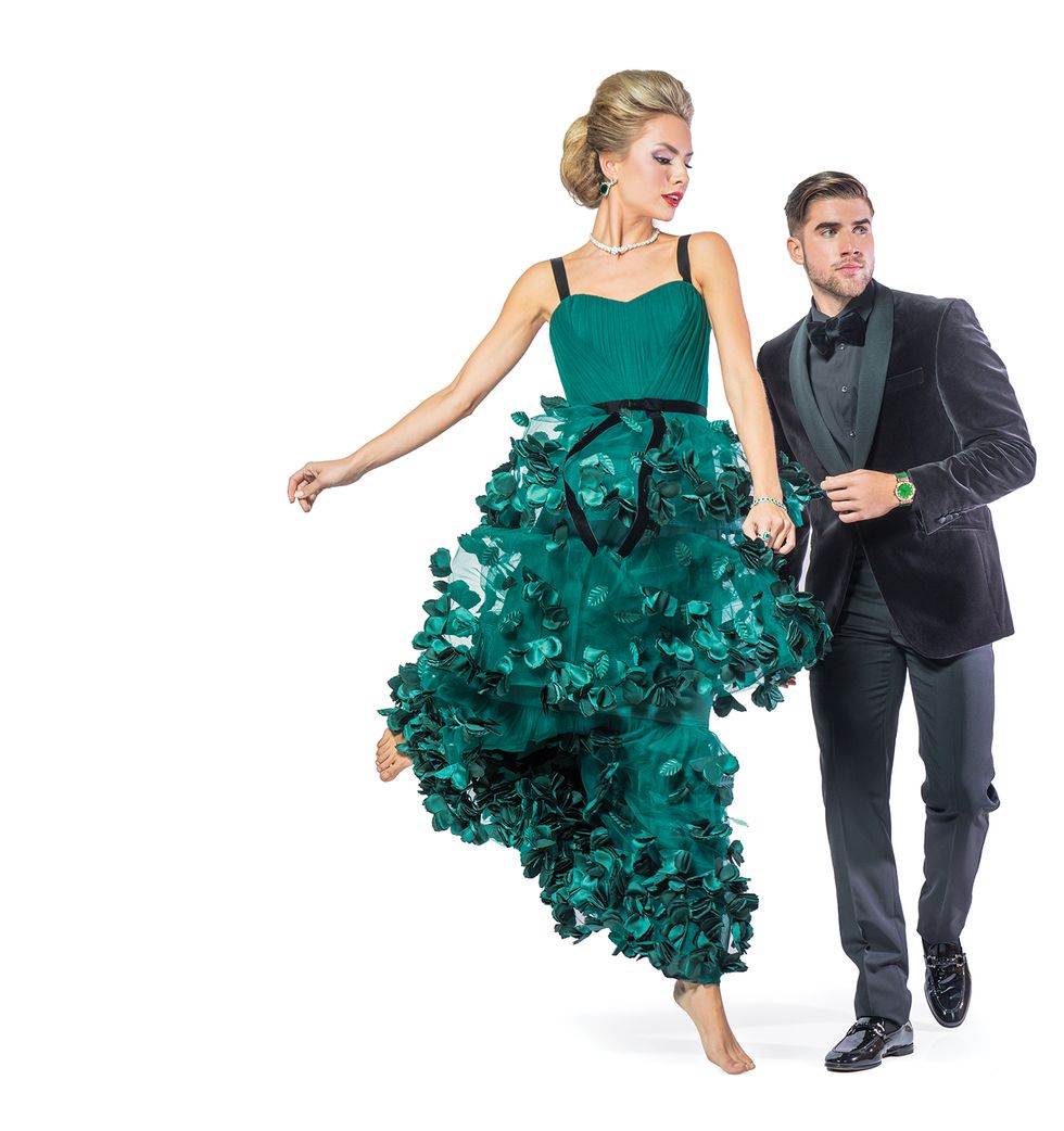 On her: Gown, $1,295, by Marchesa at Neiman Marcus; emerald earrings, $506,000, tennis bracelet, $31,320, diamond necklace, $135,000, and green diamond ring, $387,000, all by Vander Dys Collection at Vander Dys Fine Jewelers. On him: Pants, $495, and jacket, $945, both by Richard James, bow tie, $260, by Tom Ford, all at Neiman Marcus; King Gold Classic Fusion watch, price upon request, at Hublot.