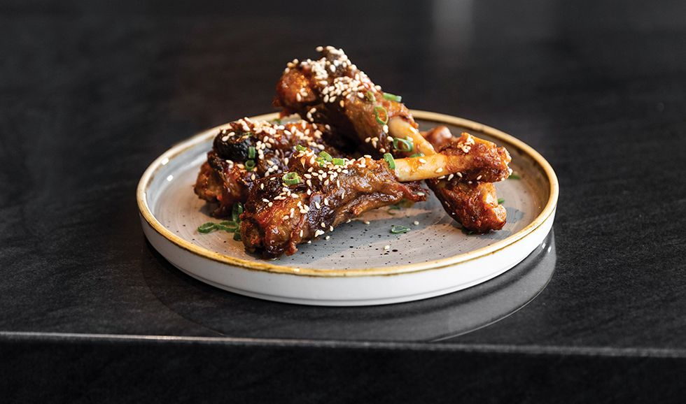 Terrace 54’s Duck Confit Wings with scallions, sesame seeds, coriander and Korean pepper sauce