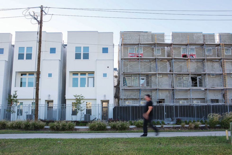 Pumped Up Crossfit EaDo founder Shahin Naghavi, above, says his is the largest crossfit box in the U.S. and, at left, a neighborhood construction.