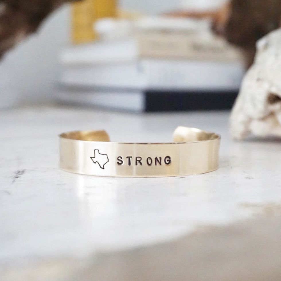 Hand-stamped Texas Strong bracelet, $40, by All The Wire at allthewire.com. The  Dallas area designers are donating $10 of every purchase to the Humane Society and  the American Red Cross.