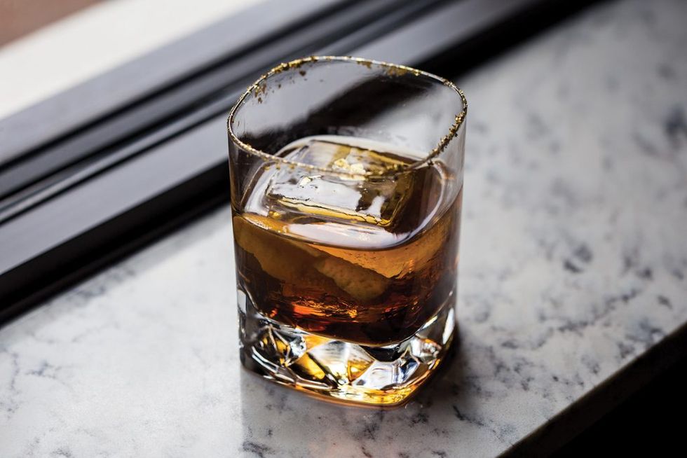 The signature Potente Gold cocktail, with whiskey, Cointreau, Kahlua and orange bitters