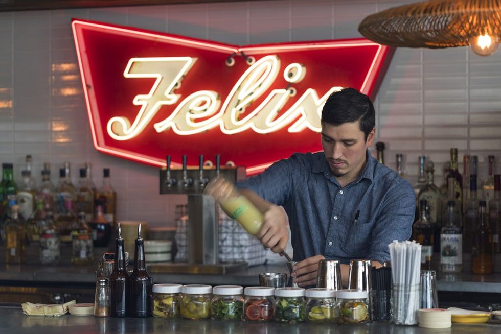 The original Felix sign hangs behind the bar at Superica.
