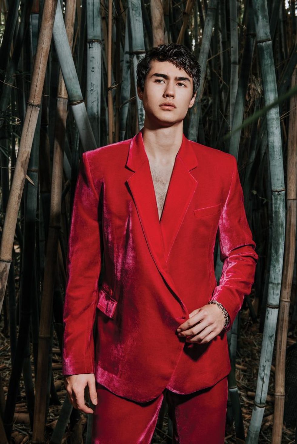 Hot pink velvet double-breasted suit, $1,850, by custom order. With bracelet, $14,500, at Tenenbaum Jewelers.