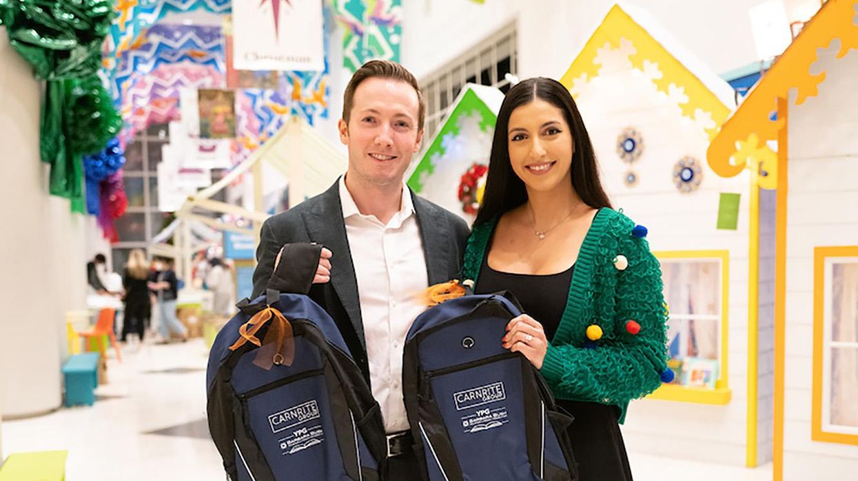 Who Are You Calling Tacky?! At Festive Function, YoPros Stuff Backpacks Instead of Stockings